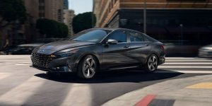 A charcoal 2021 Hyundai Elantra being driven on the road. | Hyundai dealer in Little Rock, AR.