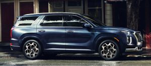 Profile view of a parked navy 2022 Hyundai Palisade. | Hyundai dealer in Little Rock, AR.