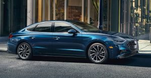 A blue 2021 Hyundai Sonata aprked in front of a building. | Hyundai dealer in Little Rock, AR.