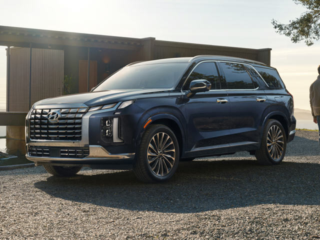 Profile view of a navy blue 2023 Hyundai Palisade. | Cars for Sale in Little Rock, AR | Crain Hyundai of Little Rock