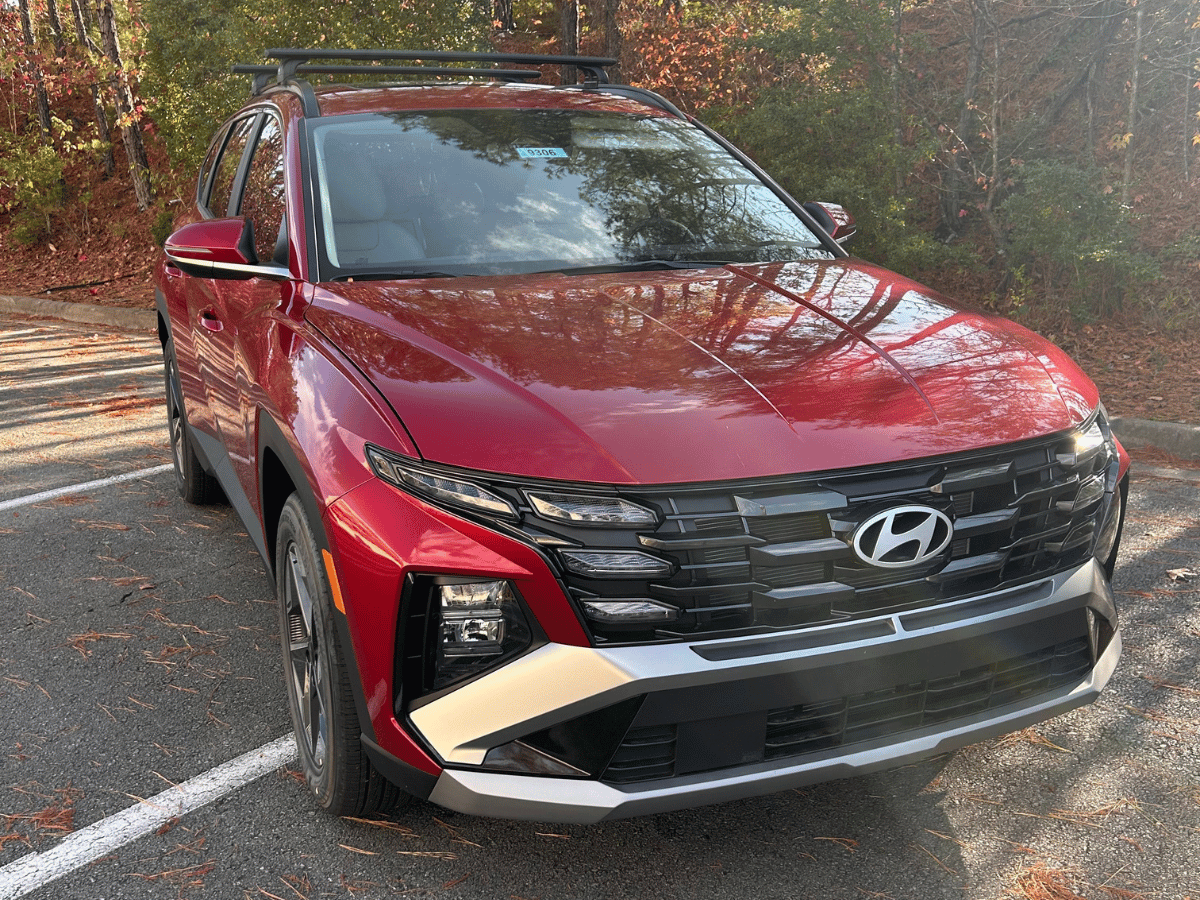 Red 2025 Hyundai Tucson SE parked at Crain Hyundai of Little Rock, Arkansas dealership