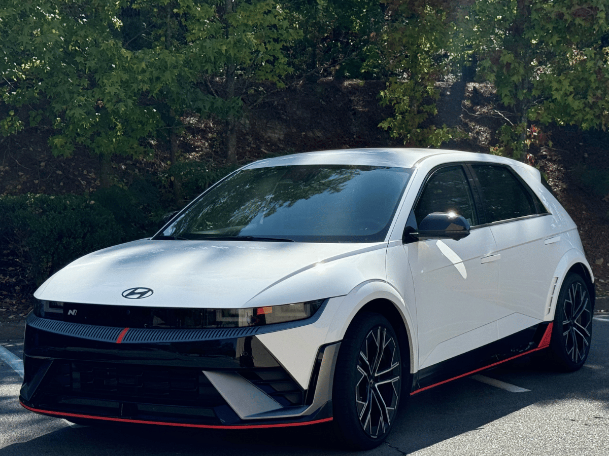 White 2025 Hyundai Ioniq 5 N electric SUV parked near Crain Hyundai of Little Rock with black and red trim detailing